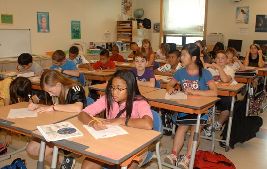 Students sit at their desks in class