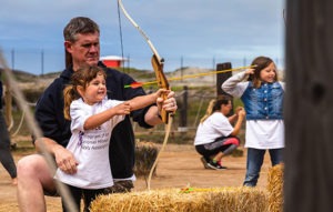 Healing Adventure: Father and daughter doing archery