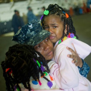 Service member mom and her daughters cry