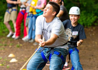 Kids work together on rope swing