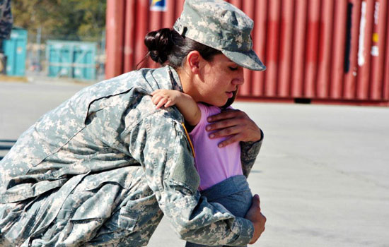 Deployment: Military mom hugging her baby