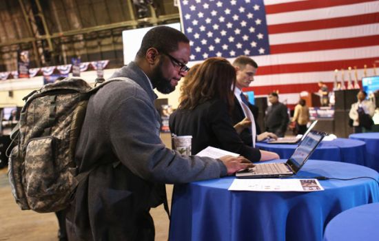 veteran on laptop at hiring event